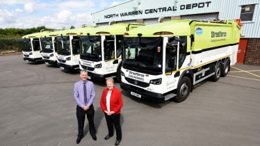 Sheila Bibb in front of West Lindsey's fleet of refuse freighters