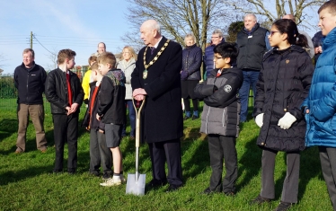 District Council Chairman Steve England leads the turf cutting ceremony.